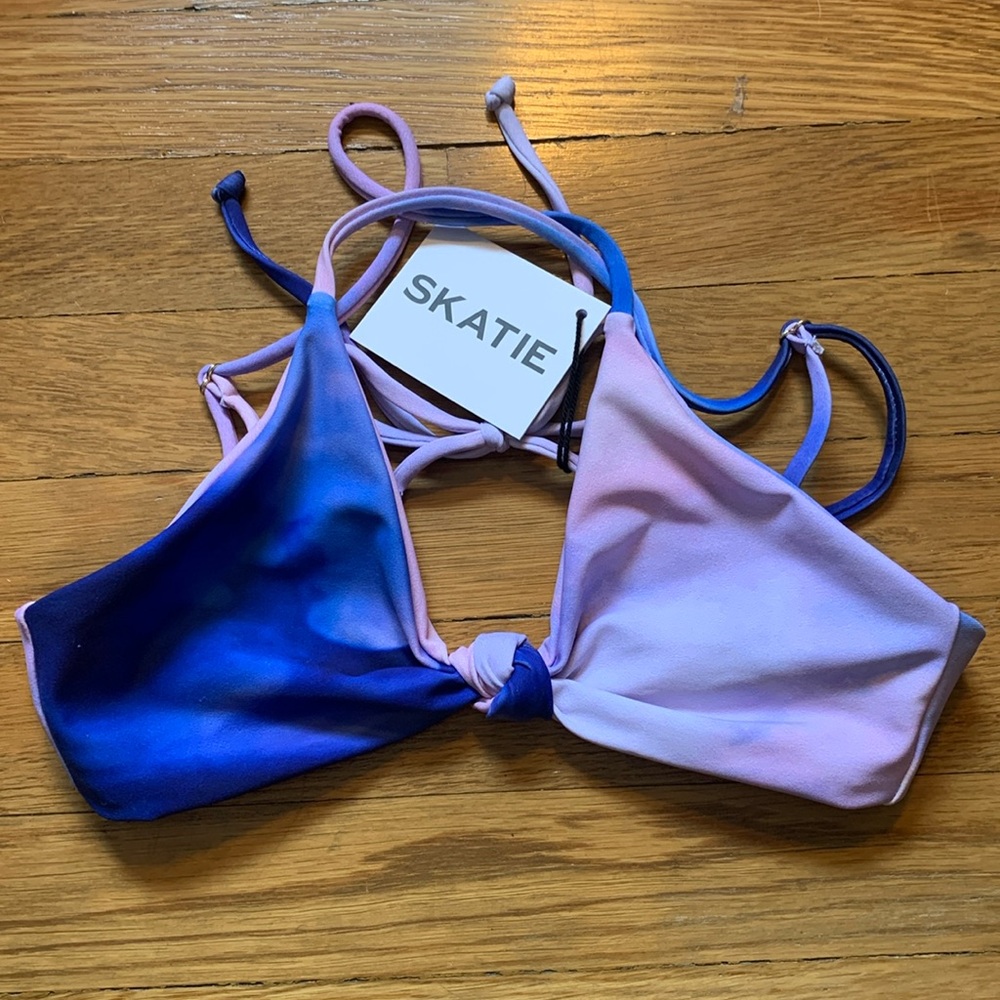 Skatie brand bikini top in blue/pink cloud like pattern.